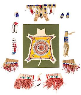 A Collection of Native American Garments and Headdresses Width of widest 6 3/4 inches.