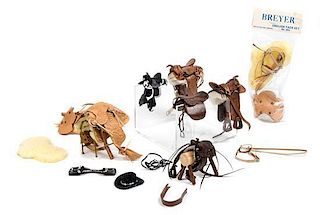 A Group of Nine Miniature and Diminutive Leather Saddles Length of longest 5 inches.