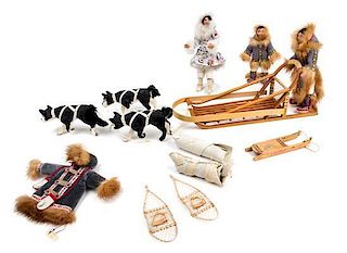 A Sled Dog Team Length of largest sled 9 1/8 inches.