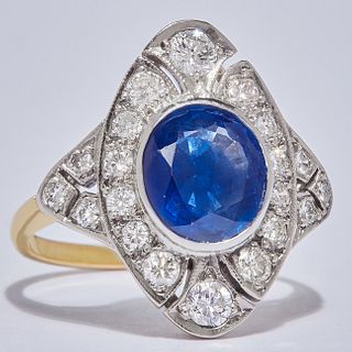 SAPPPHIRE AND DIAMOND DRESS RING, in 18-ct gold. Set with a central blue sapphire of approx. 2.90 ct. Flanked with diamonds totalling approx. 0.70 ct.