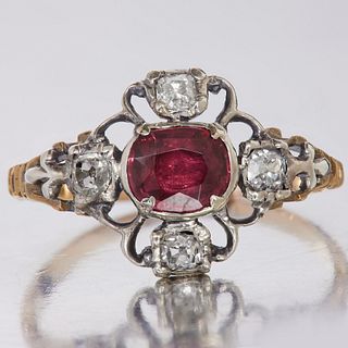 GEORGIAN RUBY AND DIAMOND RING, set to the center with a ruby of approx. 0.70 ct. flanked with 4 diamonds to the openwork, part scrolling head. Size O