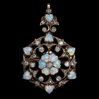 VICTORIAN OPAL AND DIAMOND PENDANT/BROOCH, of openwork scrolling design. Set with a central opal cluster, accentuated with diamonds and further heart 