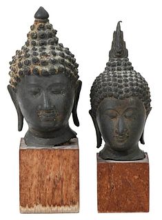 Two Thai Bronze Heads of Buddha on Wood Stands