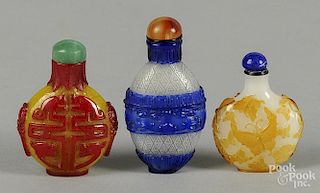 Three Chinese two-color glass snuff bottles.