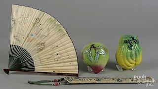 Pair of Chinese pottery fruit, together with a fan with an embroidered case.