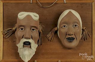 Pair of Korean pottery masks, 11'' x 16 1/2'' (mounting).