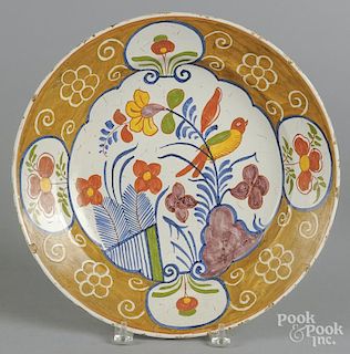 Delft polychrome charger, 18th c., initialed GVS on underside, 14'' dia.