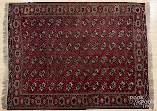 Semi antique Bohkara carpet, 11'3'' x 8'9''.