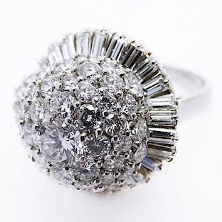 6.20 Carat Round Brilliant and Baguette Cut Diamond and Platinum Ring set in the Center with a .70 Carat Diamond.