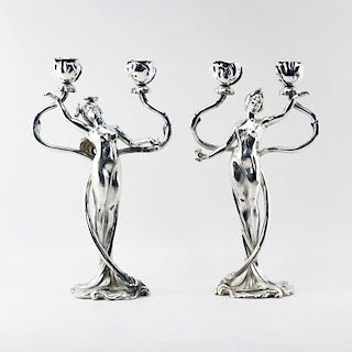 C. Bonnefond, French (19/20th Century) Pair of Art Nouveau Silvered metal figural candelabra.