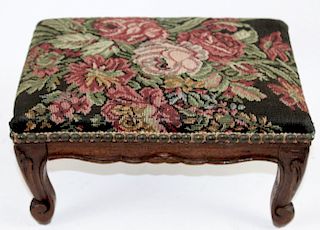 Needlepoint upholstered footstool