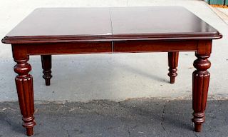 Mahogany dining table with fluted tapered legs