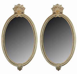 A pair of Italian Rococo oval mirrors