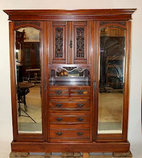 English wardrobe in mahogany with center drawers