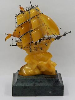 Carved Amber Ship on Marble Base.