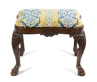 An English Carved Mahogany Ottoman Width 26 inches.