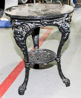 A Victorian Style Wrought Iron Marble Center Table Height 27 x diameter 22 inches.