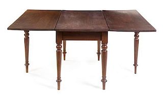 An American Cherry Drop Leaf Table Height 29 1/4 x width 46 x depth 25 1/2 inches (closed).