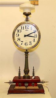 An Assembled Table Clock Height 43 1/2 inches (without shade).