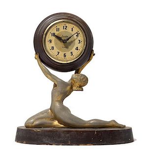 An Art Deco Cast Metal Figural Clock Height 12 inches.