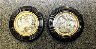 A Pair of Continental Silvered Roundels. Diameter of each 6 5/8 inches.