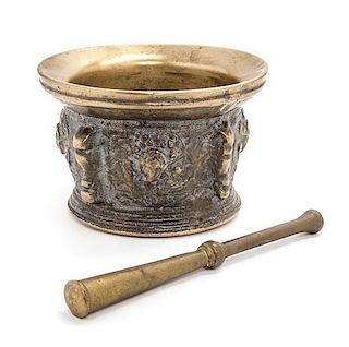 A Bronze Mortar and Pestle. Diameter of pestle 5 1/2 inches.