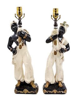 A Pair of Continental Parcel Gilt Porcelain Figural Lamps Height 18 inches.