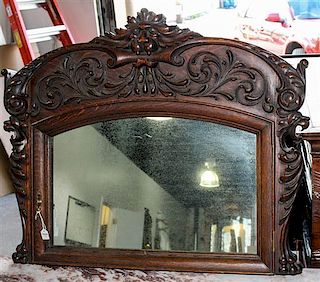 * A Renaissance Revival Carved Oak Mirror Height 23 x width 29 inches.