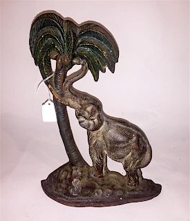 A Cast Metal and Polychrome Elephant Doorstop. Height 13 3/4 inches.