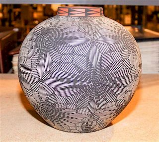 A Native American Pottery Vessel Height 9 1/2 inches.
