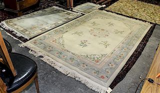 A Group of Three Chinese Wool Rugs Largest: 8 feet 9 inches x 5 feet 6 inches.