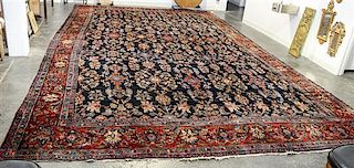A Persian Wool Rug 22 feet 10 inches x 12 feet 5 inches.