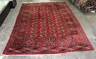 * A Bokhara Wool Rug 8 feet 10 inches x 5 feet 1 inch.