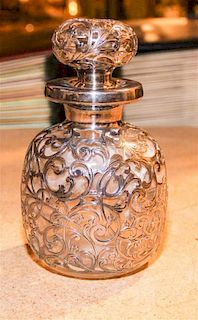 A Silver Overlay Glass Bottle, , having foliate decorated overlay.