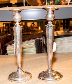 A Pair of American Silver Candlesticks, makers mark obscured, having a baluster form cup surmounting an octagonal tapering st