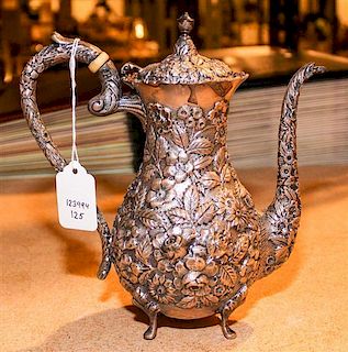An American Silver Teapot, Baltimore Silversmiths Mfg. Co., having an urn finial, the body decorated with floral and foliate 