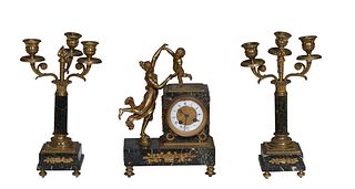French Diminutive Three Piece Gilt Spelter and Marble Clock Set, 19th c., the highly figured verde antico marble plinth with an enamel dial time and s