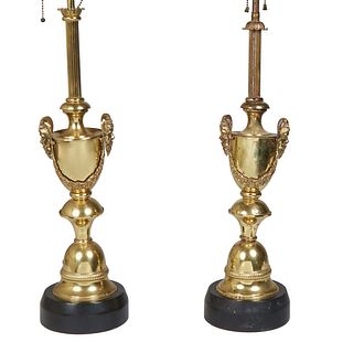 Pair of Brass Louis XVI Style Lamps, 20th c., of urn form with mask handles joined by garlands, on a knopped base on an ebonized plinth, H.- 22 in., D