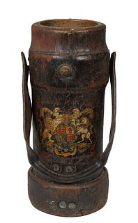 English Leather Cylindrical Shot Bucket, 19th c., with a leather carrying strap, the side with armorial decoration, H.- 13 5/8 in., W.- 6 1/2 in., Dia