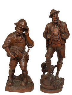Two German Hand Carved "Black Forest" Wooden Figures, 20th c., one of a wood cutter in lederhosen; the second of a hunter with a gun and a dog, Hunter