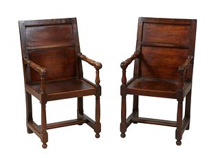 Pair of French Carved Oak Louis XIII Style Fauteuils, 19th c., the canted rectangular back issuing two turned arms over a solid seat, on turned tapere