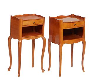 Pair of French Louis XV Style Carved Cherry Nightstands, 20th c., the bowed three-quarter galleried tops over a frieze drawer and open storage, on tap