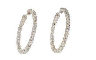 Pair of 14K White Gold In and Out Hoop Earrings, mounted with round diamonds on the interior and exterior, total diamond weight- 2.75 cts., Dia.- 15/1