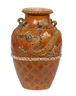Large Chinese Earthenware Baluster Vase, late 19th c., the everted rim neck with applied ring handles over relief dragon and cloud decoration above in