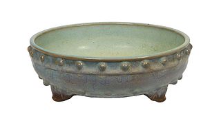 Chinese Blue Glazed Circular Earthenware Center Bowl, 20th c., the exterior with a nubbed border over a lower nubbed band, on tripodal feet, H.- 3 in.