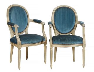 Pair of French Polychromed Beech Fauteuils, 20th c., the canted curved oval upholstered medallion back over upholstered arms, to bowed seats on turned