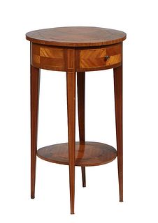 Louis XVI Style Marquetry Inlaid Walnut Lamp Table, late 19th c., the circular top over a wide skirt with a frieze drawer, on tapered square legs join