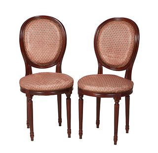 Pair of French Louis XV Style Carved Beech Side Chairs, 20th c., the canted cushioned medallion back over a circular seat, on turned tapered reeded le
