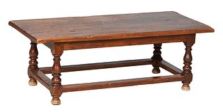 French Provincial Carved Oak Coffee Table, early 20th c., the thick rectangular top over a carved skirt, on tapered turned cylindrical legs joined by 