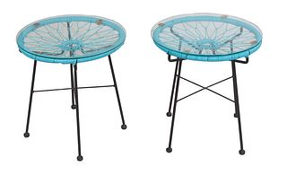 Pair of Mid-Century Wrought Iron End Tables, 20th c., the glass tops over blue circular plastic wrapped tops on four cylindrical legs joined by an X-f